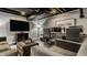 A finished basement office with dark ceilings and a comfortable lounge area at 654 E 79Th St, Indianapolis, IN 46240