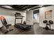 A finished basement gym with a treadmill, weight bench and motivational poster at 654 E 79Th St, Indianapolis, IN 46240
