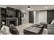 A finished basement featuring plush gray carpeting, fireplace and convenient access to the exterior at 654 E 79Th St, Indianapolis, IN 46240
