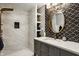 An elegant bathroom featuring decorative tile, white marble shower and a brass fixtures at 654 E 79Th St, Indianapolis, IN 46240