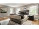 Serene bedroom with large windows, neutral tones, and a comfortable king-size bed at 654 E 79Th St, Indianapolis, IN 46240
