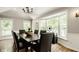 Bright dining room with large windows, a chandelier, and hardwood floors at 654 E 79Th St, Indianapolis, IN 46240