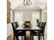 Traditional dining room with dark furniture and decorative lighting at 654 E 79Th St, Indianapolis, IN 46240