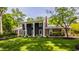 Beautiful home showcasing manicured front lawn, mature trees, and an attractive exterior at 654 E 79Th St, Indianapolis, IN 46240