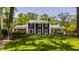 Charming two-story home with a manicured lawn and a classic black fence at 654 E 79Th St, Indianapolis, IN 46240