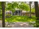 Charming two-story home with a black metal fence and green lawn at 654 E 79Th St, Indianapolis, IN 46240