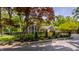 Charming two-story home with a black metal fence and landscaped yard at 654 E 79Th St, Indianapolis, IN 46240