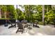 Outdoor patio featuring a stone fire pit surrounded by Adirondack chairs, perfect for entertaining at 654 E 79Th St, Indianapolis, IN 46240