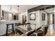 Open concept kitchen, dining, and living areas with hard wood floors and art deco styling at 654 E 79Th St, Indianapolis, IN 46240