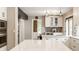 Bright kitchen features white cabinetry, quartz countertops, and stainless steel appliances at 654 E 79Th St, Indianapolis, IN 46240