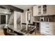 Kitchen and dining area with modern table and stainless steel beverage cooler at 654 E 79Th St, Indianapolis, IN 46240