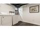 A laundry room with white appliances and stylish white shiplap walls at 654 E 79Th St, Indianapolis, IN 46240