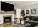 Living room with a comfortable sectional couch and fireplace at 654 E 79Th St, Indianapolis, IN 46240