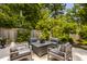Inviting outdoor patio with comfortable seating, ideal for relaxation and enjoying the serene backyard view at 654 E 79Th St, Indianapolis, IN 46240