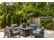 Serene outdoor patio with comfortable seating surrounded by lush greenery, offering a peaceful retreat at 654 E 79Th St, Indianapolis, IN 46240