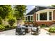 Cozy patio with cushioned seating and landscaping, perfect for outdoor entertaining and relaxation at 654 E 79Th St, Indianapolis, IN 46240