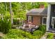 Cozy brick patio with wrought iron fencing, a fire pit, and chairs offers outdoor living space at 654 E 79Th St, Indianapolis, IN 46240
