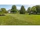 Expansive backyard with lush green lawn and mature trees, creating a peaceful outdoor space at 7323 Elm Ridge Dr, Indianapolis, IN 46236