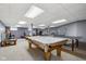 Recreational basement with a pool table, ping pong, and a cozy entertainment area at 7323 Elm Ridge Dr, Indianapolis, IN 46236