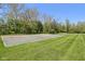 This basketball court is ready for a great game with trees surrounding it at 7323 Elm Ridge Dr, Indianapolis, IN 46236