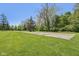This expansive basketball court has trees on the back and a great space for playing your favorite game at 7323 Elm Ridge Dr, Indianapolis, IN 46236