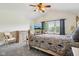 Bedroom with a large bed, dresser, and ceiling fan at 7323 Elm Ridge Dr, Indianapolis, IN 46236