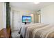 Comfortable bedroom with neutral tones, carpet, and media at 7323 Elm Ridge Dr, Indianapolis, IN 46236