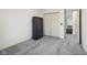 Bedroom with carpet, featuring a storage closet and a window at 7323 Elm Ridge Dr, Indianapolis, IN 46236