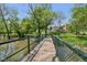Walk across this scenic bridge, located in this lovely community at 7323 Elm Ridge Dr, Indianapolis, IN 46236