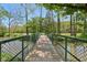 Scenic bridge over a creek, surrounded by lush greenery and trees at 7323 Elm Ridge Dr, Indianapolis, IN 46236