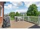 Outdoor deck featuring a dining set and barbecue grill for outdoor entertaining at 7323 Elm Ridge Dr, Indianapolis, IN 46236