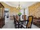Dining area featuring decorative wallpaper, a large dining table and natural light at 7323 Elm Ridge Dr, Indianapolis, IN 46236