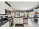 Well-appointed kitchen features granite countertops, stainless steel appliances, and an adjacent dining area at 7323 Elm Ridge Dr, Indianapolis, IN 46236