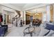 Open living space with staircase access, hardwood floors and transitional furnishings at 7323 Elm Ridge Dr, Indianapolis, IN 46236
