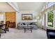 Elegant living room featuring a comfortable sofa and arched windows at 7323 Elm Ridge Dr, Indianapolis, IN 46236