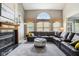 Bright living room with a large sectional sofa and a fireplace at 7323 Elm Ridge Dr, Indianapolis, IN 46236