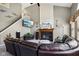 Comfortable living room with a fireplace, a mounted tv and sectional seating at 7323 Elm Ridge Dr, Indianapolis, IN 46236