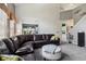 Spacious living room with plush seating and view into dining area at 7323 Elm Ridge Dr, Indianapolis, IN 46236