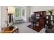 Bright office featuring a desk, chair, and bay window with shutters at 7323 Elm Ridge Dr, Indianapolis, IN 46236