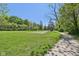 Expansive grassy park area with walking path and mature trees at 7323 Elm Ridge Dr, Indianapolis, IN 46236