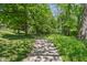 Peaceful community path surrounded by lush greenery and trees at 7323 Elm Ridge Dr, Indianapolis, IN 46236