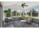 Bright and airy sunroom with ample seating, screened windows, and a view of the manicured lawn at 7323 Elm Ridge Dr, Indianapolis, IN 46236
