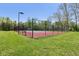 This community tennis court is ready for a game with a full fence for privacy at 7323 Elm Ridge Dr, Indianapolis, IN 46236