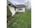 Backyard featuring a well-maintained lawn and minimal garden with a partial fence at 7450 Cobblestone W Dr, Indianapolis, IN 46236
