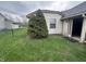 Fenced backyard showing an open doorway to the house at 7450 Cobblestone W Dr, Indianapolis, IN 46236
