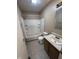 Bathroom featuring a shower-tub combo, tile flooring, and a single sink vanity at 7450 Cobblestone W Dr, Indianapolis, IN 46236