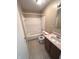 Small bathroom with a bathtub and tiled floors at 7450 Cobblestone W Dr, Indianapolis, IN 46236