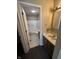 Bathroom featuring a shower-tub combo, tile flooring, and a single sink vanity at 7450 Cobblestone W Dr, Indianapolis, IN 46236