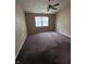Bedroom featuring a ceiling fan, carpet flooring, and a window providing natural light at 7450 Cobblestone W Dr, Indianapolis, IN 46236