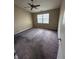 Bedroom with ceiling fan and window letting in natural light at 7450 Cobblestone W Dr, Indianapolis, IN 46236